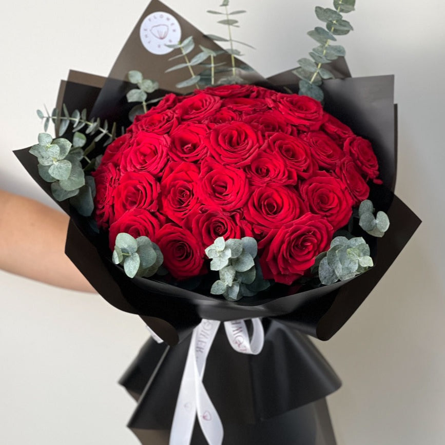 25 Red Roses in Black Wrapping